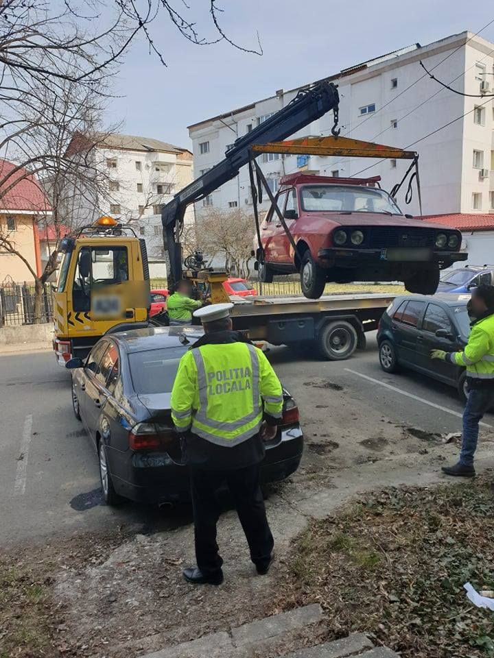 An employee walks among newly produced cars at a park of Chana Auto Co. Ltd in Chongqing Municipality