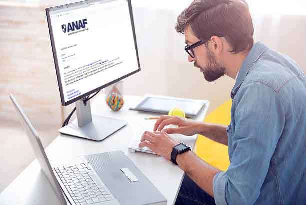 Man writing codes on computer