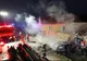 O maşină a luat foc după ce a intrat într-o casă