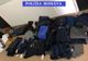 Îmbrăcăminte contrafăcută, confiscată de polițiști, în Târgul Obor